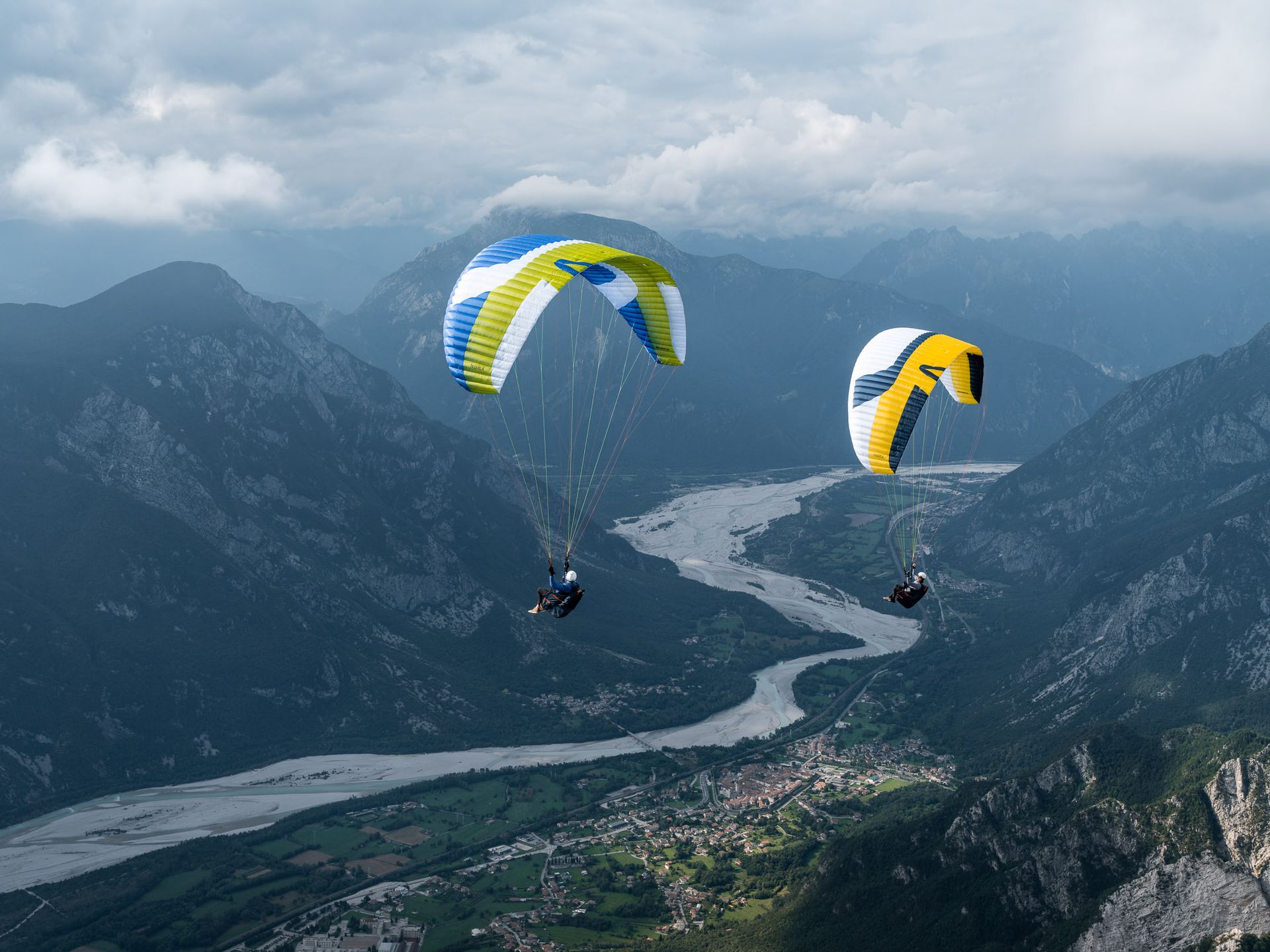 Two paragliders above the Soča river valley, Slovenia